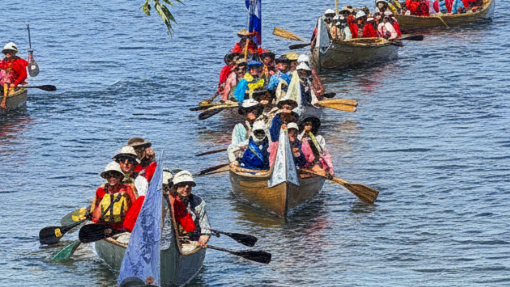 Voyageur canoes on the water